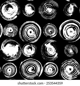 Contemporary art design grunge vector seamless texture for textile design. It was drawn by dry brush. Black and white grungy pattern with large circle elements. Can be used as a print