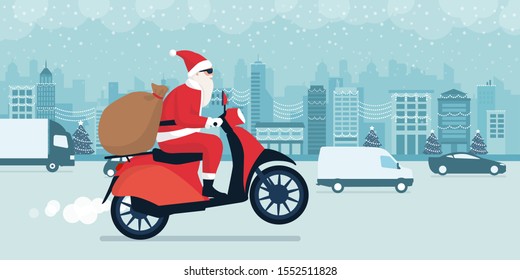 Contemporary Santa Claus delivering gifts on Christmas Eve, he is riding a red moped and driving in the city street traffic