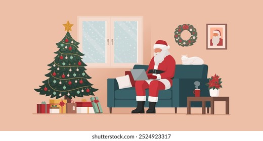 Contemporary Santa Claus working at home, he is sitting on the couch and typing on his laptop