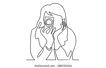 Continue line of woman holding digital camera