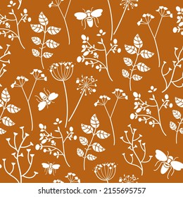 continuous botanical pattern.White silhouettes of field plants on a mustard background.For textile,clothing,wallpaper,paper,packaging.