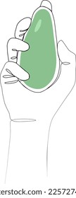 continuous drawing of avocado in hand with one line.