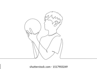 Continuous line art of a young man holding a ball in his hands getting ready to throw it. The concept of a healthy lifestyle, basketball and volleyball player, summer holiday. Can be used for animatio