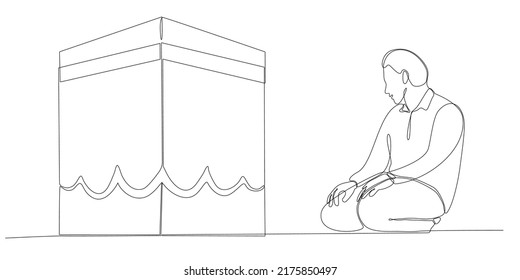 A continuous line drawing of a man facing the Ka'aba raised his hand in prayer. Muslim men pray for Allah and raise their hands facing the Kaaba isolated on white background.