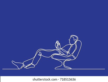 continuous line drawing of man relaxing in chair with his mobile phone