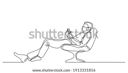 continuous line drawing of man wearing face mask relaxing in chair with his mobile phone