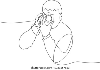 continuous line drawing of Portrait of a photographer covering his face with the camera.