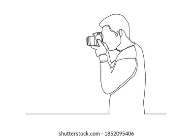 Continuous line drawing of professional man photographer take picture use camera. One line art concept of photography. Vector illustration