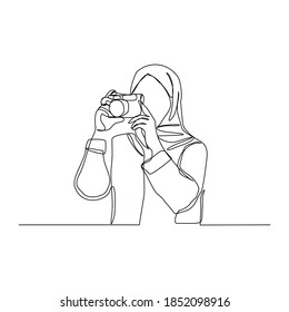 Continuous line drawing of professional woman muslim hijab photographer take picture use camera. One line art concept of photography. Vector illustration