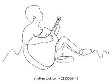 continuous line drawing of sitting guitarist playing guitar. Musical home wall decor art poster print concept. Modern one line draw design vector illustration  