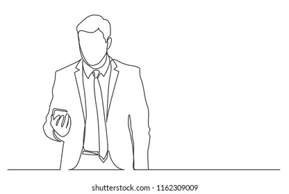 continuous line drawing of standing businessman checking mobile phone