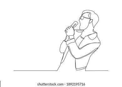 Continuous line drawing of young happy male pop singer holding microphone and singing on stage. Single one line art of musician artist performance concept design vector illustration