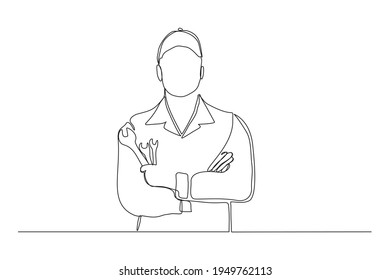 Continuous line drawing of young male mechanic pose holding set of wrench. Single one line art of man professional job profession minimalist concept. vector illustration