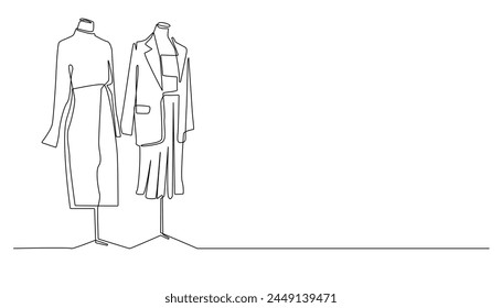 línea continua de ropa de mujer montada en un maniquí. dibujo de una línea de diseñadora de moda femenina, lugar de costura, boutique.