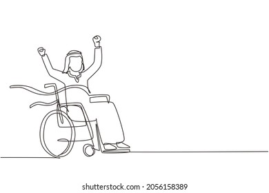 Continuous one line drawing Arab male young wheelchair user crossing red finish line. Happy winner, successful champion. Society, disabled people community. Single line draw design vector illustration