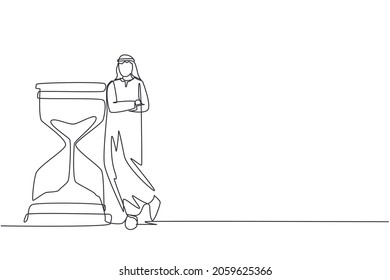 Continuous one line drawing Arab businessman lean huge giant hourglass  Time is money financial investment concept  Time management conceptual metaphor  Single line draw design vector illustration