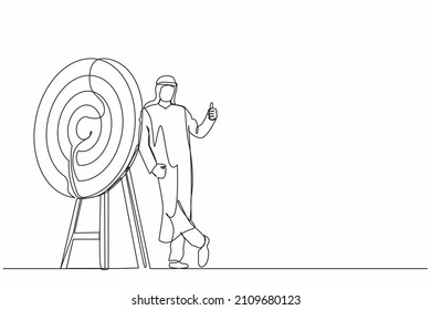 Continuous one line drawing Arabian businessman or manager is standing or leaning the target with thumbs up gesture. Arrow hit the target exactly. Single line draw design vector graphic illustration