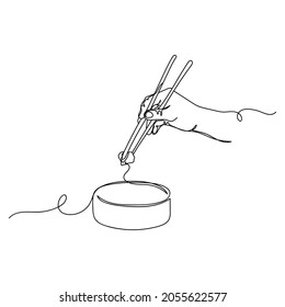 Dibujo continuo de una línea de un alimento asiático en silueta sobre un fondo blanco. Linear estilizado.