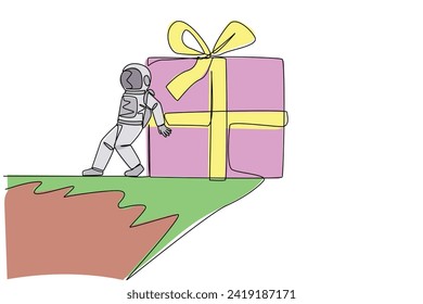 Continuous one line drawing astronaut pushed giant gift box down with his back from the edge of the cliff. Cosmic galaxy space concept. Spaceman. Cosmonaut. Single line draw design vector illustration