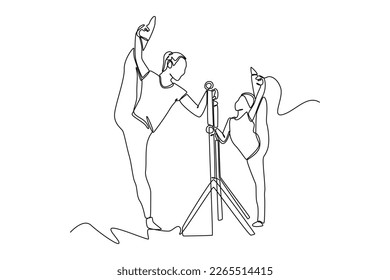 Continuous one line drawing Ballet school teacher helps young ballerinas practice in class. Class in action concept. Single line draw design vector graphic illustration.