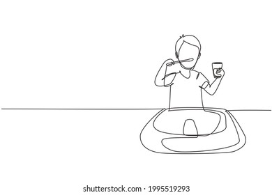 Continuous one line drawing boy brushing his teeth in sink. Routine habits every morning for cleanliness, health, and freshness of mouth and teeth. Single line draw design vector graphic illustration