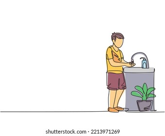 Continuous one line drawing a boy washes his hands in the sink, there is a soap dispenser by the faucet and there is a pot of plants under the sink. Single line draw design vector graphic illustration