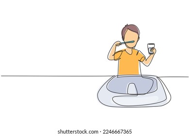 Un niño que dibuja una línea continua lavándose los dientes en el lavabo. Los hábitos rutinarios cada mañana para la limpieza, la salud y la frescura de la boca y los dientes. ilustración vectorial de diseño de línea única