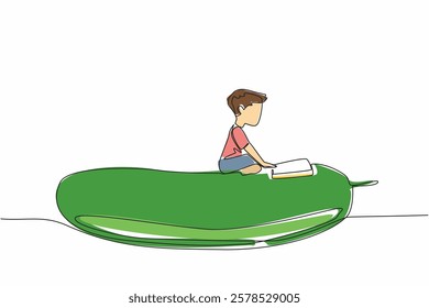 Continuous one line drawing boy reading on cucumber. Reading on a giant cucumber shaped pillow. Calm and focused. Boy Reading Book at Vegetables and Fruits. Single line draw design vector illustration