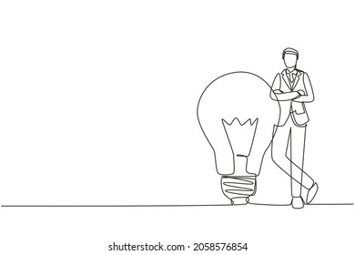 Continuous one line drawing businessman leaning on giant lightbulb, business idea. Business people have ideas leaning against the lamp symbol is good idea. Single line draw design vector illustration