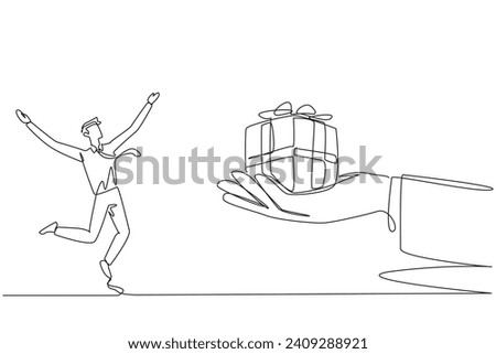 Continuous one line drawing businessman was excited to get gift box from a giant hand. Get important rewards. Memories of extraordinary career achievements. Single line draw design vector illustration
