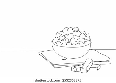 Continuous one line drawing caramel popcorn in a brown wooden bowl and on a cloth base. Snacks with a sweet taste. Munchies. National Caramel Popcorn Day. Single line draw design vector illustration