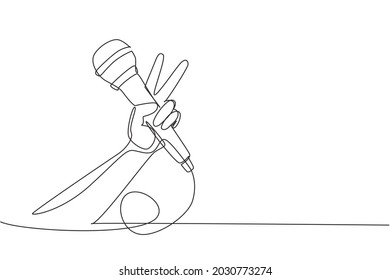 Continuous One Line Drawing Child Holding Microphone On White Background, Closeup Of Hand. Mic With Victory Gesture. Karaoke Kid Sings Song To Microphone. Single Line Draw Design Vector Illustration