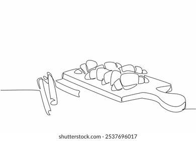 Continuous one line drawing cinnamon crescents on cutting board and few cinnamon sticks. Get ready to serve a healthy snack. National Cinnamon Crescent Day. Single line draw design vector illustration