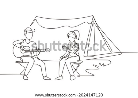 Continuous one line drawing couple tourist camping. Camper sitting by campfire next to camp tent, guy playing music guitar, people enjoy nature picnic. Outdoor summer tourism. Single line draw design