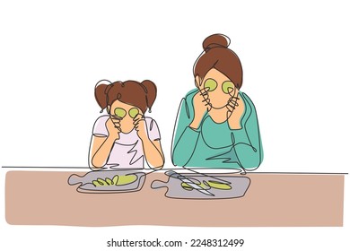 Continuous one line drawing cute little girl and her beautiful mom are holding slices of cucumber and smiling while cooking in kitchen at home. Single line draw design vector graphic illustration