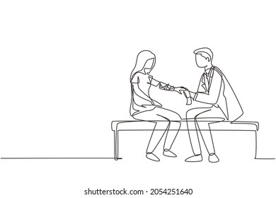 Continuous one line drawing doctor bandages patient woman hand. First aid emergency hands doing dressing bandage in Traumatology clinic. Healthcare concept. Single line draw design vector illustration