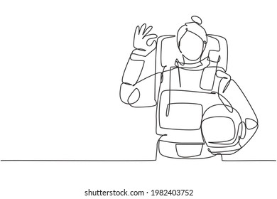 Continuous one line drawing female astronaut with gesture okay wearing spacesuits to explore outer space in search mysteries of universe. Great job. Single line draw design vector graphic illustration