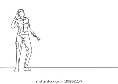 Continuous one line drawing female mechanic stands up with call me gesture and holding wrench to perform maintenance on vehicle engine. Success job. Single line draw design vector graphic illustration
