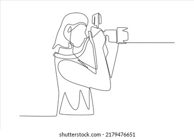 Continuous one line drawing Female photographer holding camera taking photo. World photo day concept. Single line draw design vector graphic illustration.