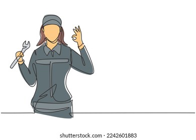 Continuous one line drawing female mechanic with gesture okay and holding wrench works to fix broken car engine in garage. Success business concept. Single line draw design vector graphic illustration