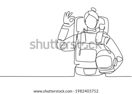 Continuous one line drawing female astronaut with gesture okay wearing spacesuits to explore outer space in search mysteries of universe. Great job. Single line draw design vector graphic illustration