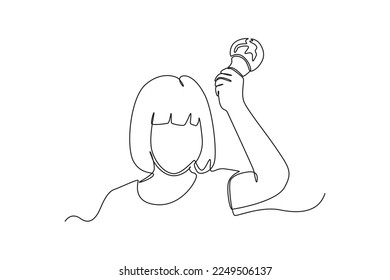 Continuous one line drawing girl is holding a light bulb in his hand. Earth hour concept. Single line draw design vector graphic illustration.