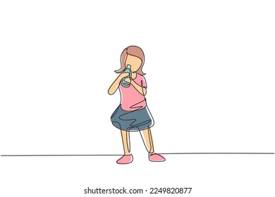 Continuous one line drawing girl standing while drinking milk in a bottle to fulfill her body's nutrition. Healthy lifestyles concept for kids. Single line draw design vector graphic illustration