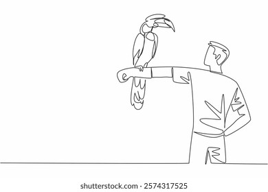 Continuous one line drawing great hornbill bird perched on hand of man. Trying to feed directly. New animal keeper on duty. Pursue hobby. Man Holding Bird. Single line draw design vector illustration