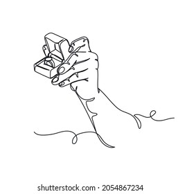 Continuous one line drawing of hand holds wedding ring, making marriage proposal romantic concept in silhouette on a white background. Linear stylized.
