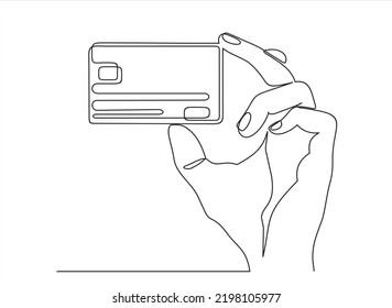 Continuous one line drawing of hand holding credit card. 