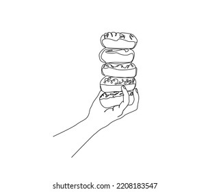 Dibujo continuo de una línea de Donuts de mano. Dibujo gráfico de líneas de dibujo de mano de donuts. 