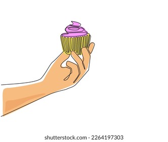 Continuous one line drawing hand holding cupcake. Birthday cake in party. Holiday celebration concept. Surprise and joyful with sweet whipped cream baked. Single line draw design vector illustration