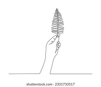 Continuous one line drawing of hand holding tropical leaf. Hand holds Polypodiales leaf outline design.  Editable stroke.