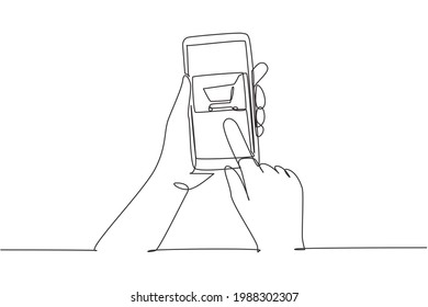 Continuous one line drawing hands holding smartphone with shopping cart image and touching screen. Digital lifestyle, internet and gadgets concept. Single line draw design vector graphic illustration